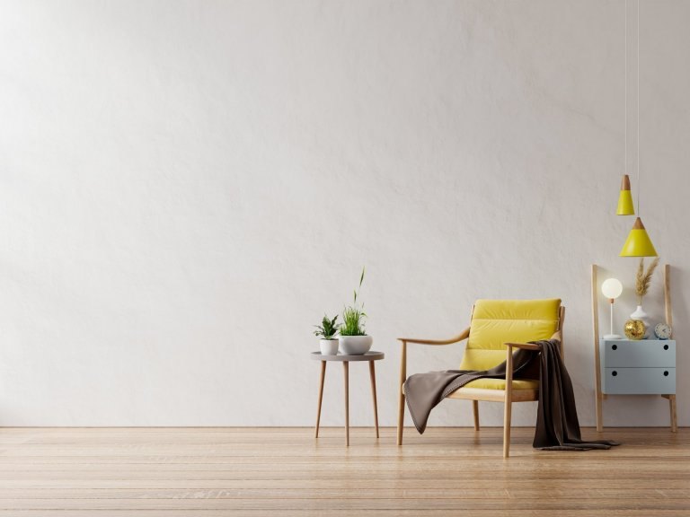 Fauteuil jaune table en bois intérieur de salon mur blanc