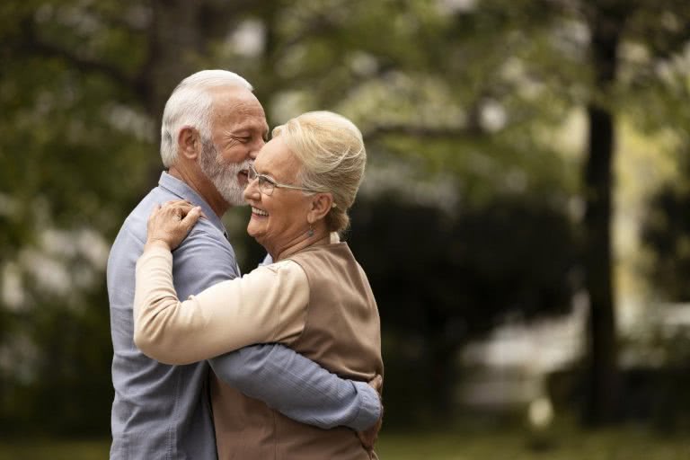 Happy elderly couple dancing